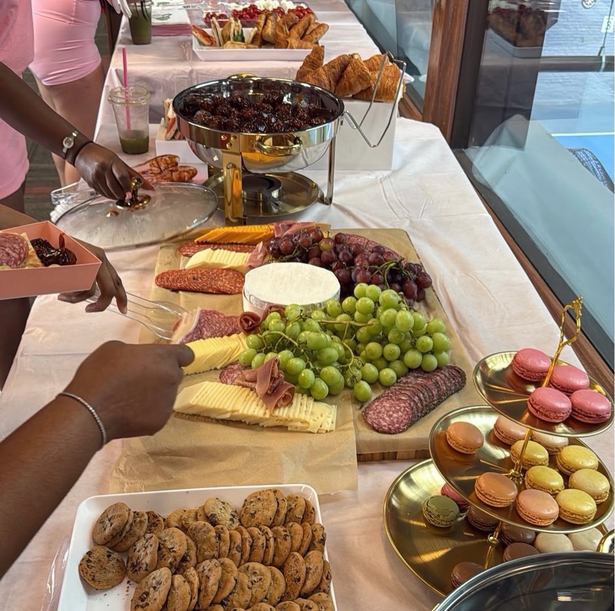 Charcuterie spread with macarons and cookies at Pretty & Pickleball