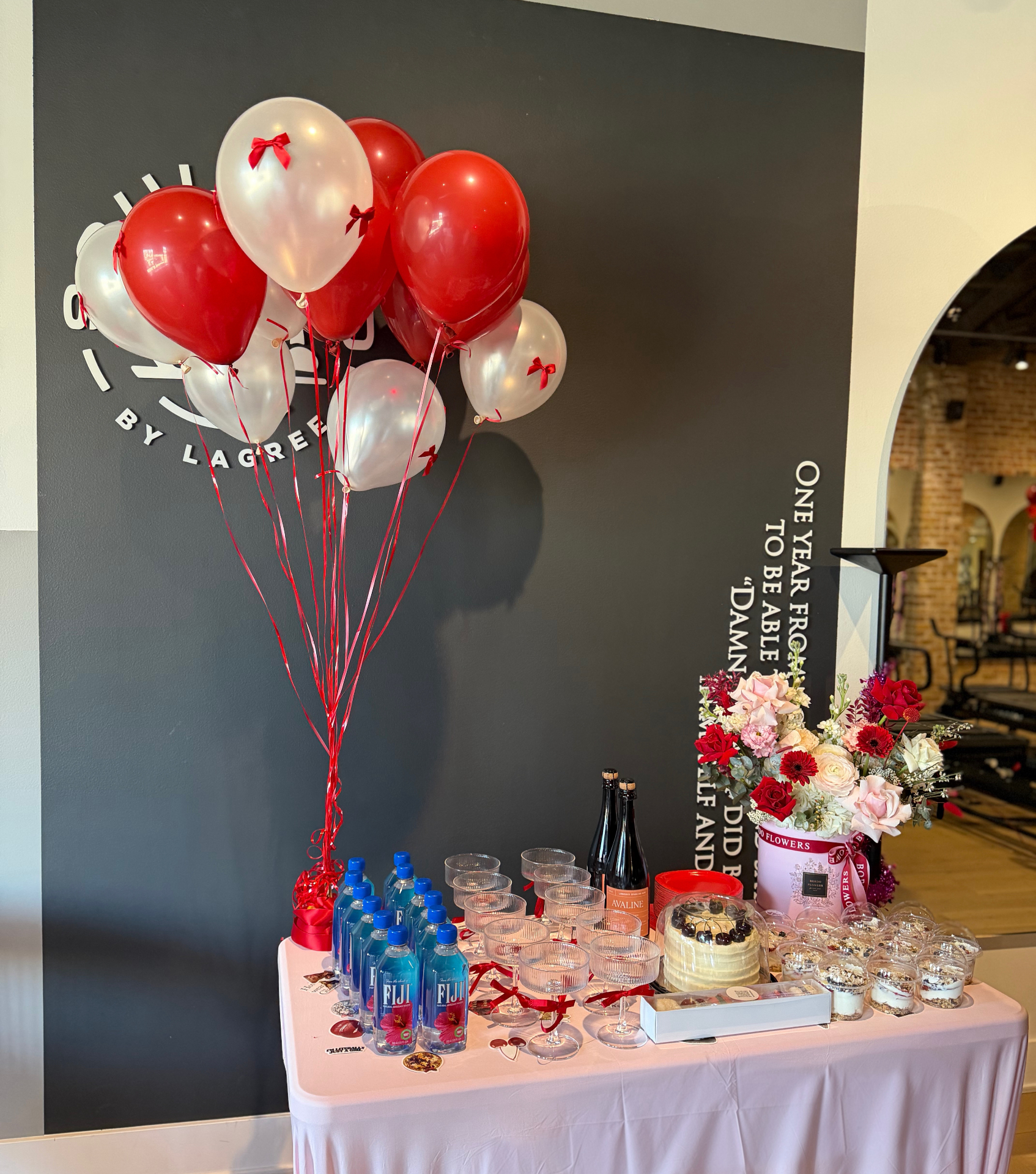 Feminine Alone Time event table with balloons and refreshments